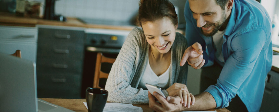 Couple interested in saving money creates a home budget